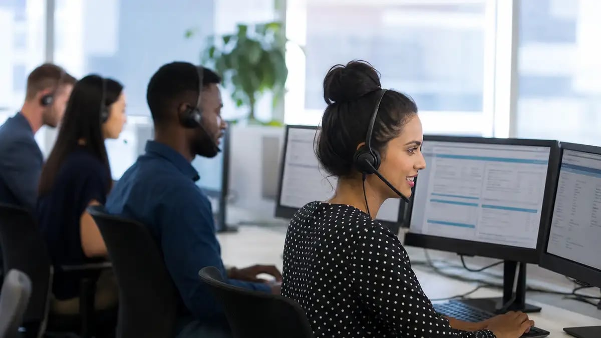 Offshore customer service agents in a modern contact centre handling energy billing and account queries